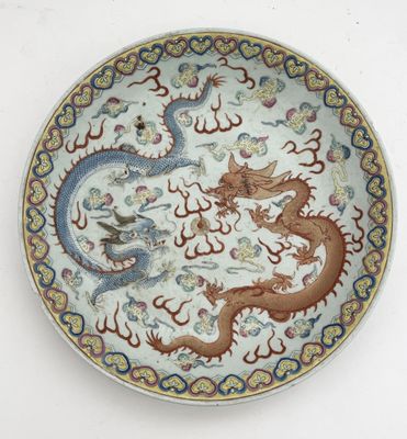an image of a plate with a dragon and a bird on it