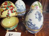 three eggs are sitting on a table with a price tag in front of them