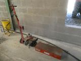 a machine that is sitting on the ground next to a wall