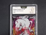 the pokemon card is in a plastic holder on a black surface
