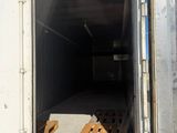 a white truck with a wooden pallet in the back of it