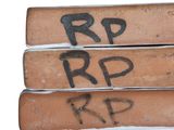 three bricks with the words r p and r p written on them
