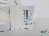a white shoe with a price tag attached to it