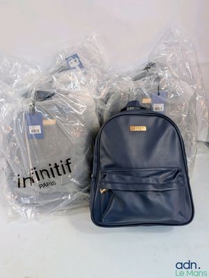 three bags of luggage sitting next to each other on a table