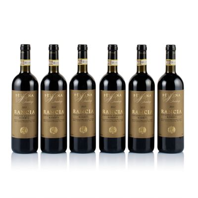 six bottles of red wine in a row on a white background