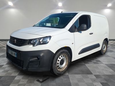 the white van is parked on a checkered tile floor