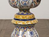 a vase that is sitting on top of a wooden table
