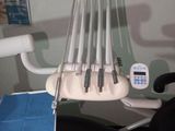 a chair that has a bunch of toothbrushes on it