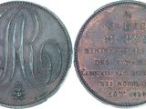 a close up of a coin with a picture of a person on it