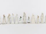 a lot of figurines that are lined up together
