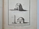 an open book with a drawing of a building and a tower
