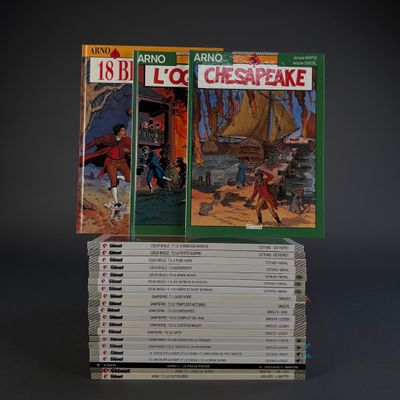 several books are stacked on top of each other on a table
