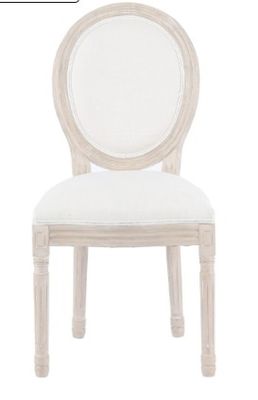 an image of a white chair with a white cushion on it