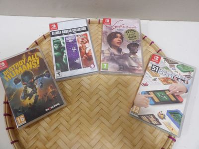 several video games are on a bamboo tray on a table