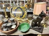a table with a lot of antiques on it