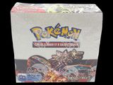 a close up of a box of pokemon cards on a black background