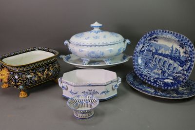 several different types of blue and white dishes and dishes on a table