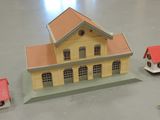 a small model of a house and a small model of a house