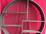 a picture of a metal shelf on a pink background