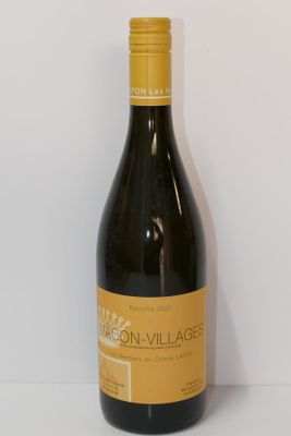 la bouteille de vin est posée sur la table à côté du mur