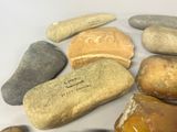many rocks that are sitting on a white surface