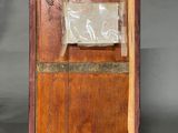a picture of a wooden box with a sign on it