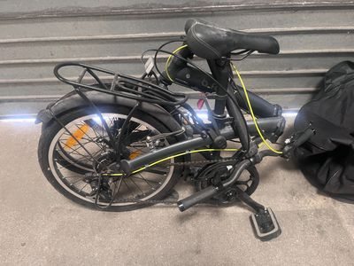 a bike that is parked next to a garage door