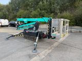 a picture of a truck with a crane attached to it ' s back