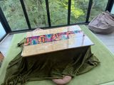 a person laying on a bed with a blanket on it
