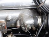 a close up view of a car engine with nozzles on it