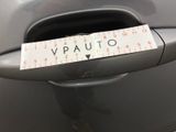 a sticker on the door handle of a car