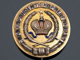 an image of a metal badge with a crown on top of it