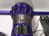 a vacuum that is sitting on a table next to other items