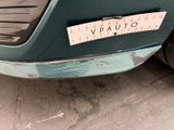 a picture of a car with a sticker on it ' s bumper