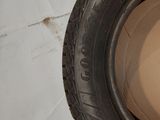 a tire that is sitting on top of a cardboard box