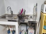 a small kitchen with a sink and a microwave in it