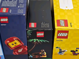 many boxes of legos that are stacked on top of each other