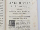 an open book with a picture of a bird on it