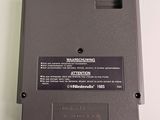 a close up of a video game on a white surface