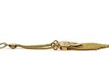 a close up of a key chain with a lizard on it