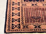 an image of a rug on the floor with a cat laying on top of it