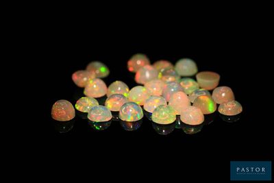 a close up of a pile of white oplite on a black background