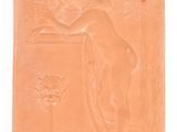 a plaque of a woman with a vase on it
