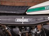 a close up of a motorcycle parked in a garage