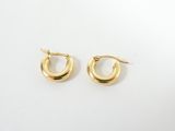 a pair of gold hoop earrings on a white background