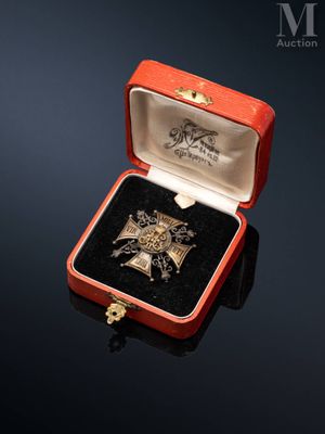 an image of a red box with a gold cross and a key in it