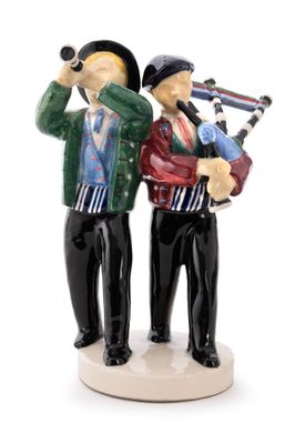 two figurines of two men standing next to each other