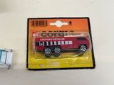 a red toy truck with a white stripe on the front