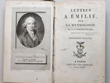 an old book with a picture of a man in a suit and tie