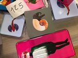 several trays of food are sitting on a table in a classroom
